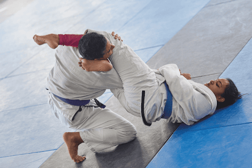 Young martial artists practising jiu-jitsu.