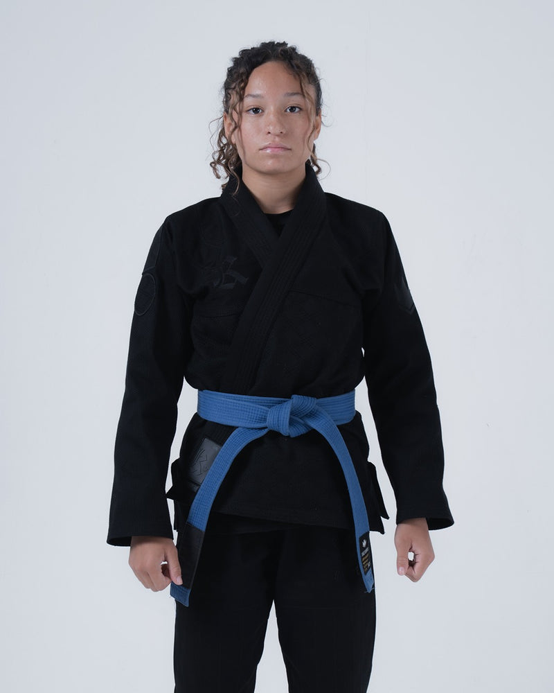 Kingz Born to Rule Women's Jiu Jitsu Gi Black - Full Body Front View Female Athlete Black Gi Blue Belt Subtle Logo Left Chest Durable Fabric BJJ Training Gi [color:Black]