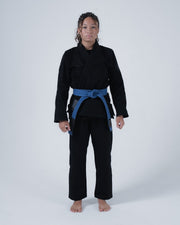 Kingz Born to Rule Women's Jiu Jitsu Gi - Black - Full Body Front View Female Athlete Solid Black Gi Blue Belt Contrast Stitching Embroidered Logos Durable Fabric Women's BJJ Training Gi [color:Black]