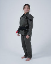 Kingz Born to Rule Women's Jiu Jitsu Gi Military Green - Full Body Front View Female Athlete Black Crown Badge Shoulder Black Belt Tailored Fit Durable Fabric BJJ Gi [color:Military Green]