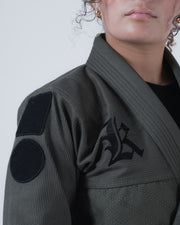 Kingz Born to Rule Women's Jiu Jitsu Gi - Military Green - Close-Up Detail View Black Logo Embroidery Shoulder Patch Textured Fabric Women's BJJ Gi Training Grappling [color:Military Green]
