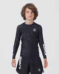 Kingz Kore V2 Youth L/S Rashguard Navy Black - Full Body Front View Teen Boy Athlete Long Sleeve Navy Blue Minimal Design White Crown Logo Circle Chest KINGZ White Sleeve Text Matching Navy Shorts Kids BJJ Training