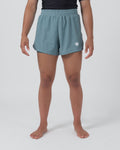 Kingz Hybrid Women's Shorts Sage - Full Body Front View Female Athlete Sage Blue-Green Color White Crown Logo Left Thigh High-Rise Elastic Waistband Competition Cut Women's Grappling Shorts No-Gi BJJ