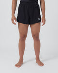 Kingz Hybrid Women's Shorts Black - Full Body Front View Female Athlete Solid Black Color White Crown Logo Left Thigh Black Elastic Waistband Competition Cut Women's Grappling Shorts No-Gi BJJ