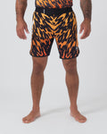 Kingz Flame Shorts Orange Black - Full Body Front View Male Athlete Bold Orange Black Tiger Flame Sublimated Print Grappling Shorts Competition Cut KINGZ KIMONOS Black Waistband Crown Logo Right Thigh Matching Flame Print Rashguard Bare Feet Men's No-Gi BJJ