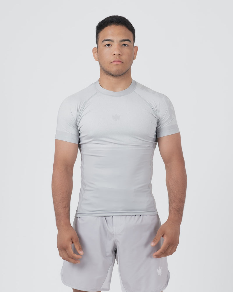 Kingz Ghost Rashguard Silver Gray - Full Body Front View Male Athlete Short Sleeve All Gray Minimal Design Subtle Crown Logo Light Gray Matching Shorts Crown Badge Compression Fit [color:Silver]