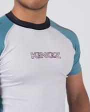 Kingz Flow Rashguard Blue/Pink - Close-Up Front View Male Athlete White Body Blue Sleeves Black Collar KINGZ Text Chest Contrast Stitching Modern Fit BJJ No-Gi Grappling Rash Guard [color:Black]