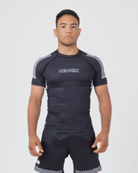 Kingz Flow Rashguard Black - Full Body Front View Male Athlete Short Sleeve Black with Silver KINGZ Text Chest Geometric Shoulder Pattern Snug Fit BJJ Grappling Rash Guard [color:Black]
