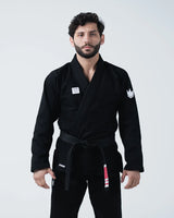 Kingz Kore V2 Jiu Jitsu Gi - Black - Front View Male Athlete Black Gi White Crown Shoulder Patch Kingz Logo Waist Black Belt BJJ Training Gi [color:Black]