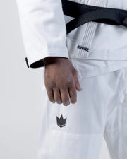 Kingz Kore V2 Jiu Jitsu Gi - White - Close-Up Detail View Black Crown Badge Left Thigh KINGZ Tag Waist Black Belt Contrast Stitching Durable Fabric BJJ Gi Training [color:White]