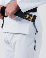 Kingz Balistico 4.0 BJJ Gi White waist detail showing hand on gold label black belt and Balistico pant print