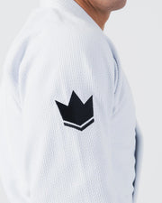 Kingz Balistico 4.0 BJJ Gi White shoulder seam closeup showing black crown logo and pearl weave texture