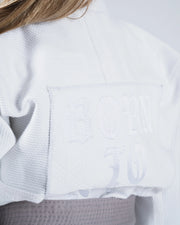 Kingz Born to Rule Youth Jiu Jitsu Gi White - Back View Close-Up Embroidered "Born to Rule" Text White Fabric Yellow Belt Contrast Youth BJJ Gi Training Apparel [color:White]