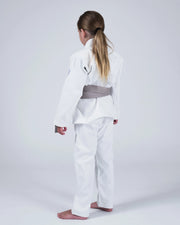 Kingz Born to Rule Youth Jiu Jitsu Gi White - Full Body Front View Young Athlete White Gi Yellow Belt Crown Badge Sleeve Embroidered Patch Durable Fabric BJJ Training Gi [color:White]