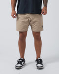 Kingz Casual Gi Shorts Khaki Tan Beige - Full Body Front View Male Athlete Khaki Tan Ripstop Casual Shorts Above-Knee Drawstring Waistband Black Woven Kingz Label Right Thigh Dark Navy T-Shirt Black White Dunk Sneakers Men's BJJ Lifestyle