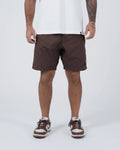 Kingz Casual Gi Shorts Brown Dark Chocolate - Full Body Front View Male Athlete Dark Brown Ripstop Casual Shorts Above-Knee Cut Drawstring Waistband Black Woven Kingz Label Right Thigh White T-Shirt Brown Nike Dunk Sneakers Men's BJJ Lifestyle