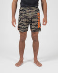 Kingz Always Hunting Shorts Green Camo - Full Body Front View Male Athlete Olive Army Green Tiger Camo Pattern KINGZ Bold Orange Text Left Leg Orange Side Accent Panels Inner Compression Shorts Orange Trim Competition Cut Men's Grappling Shorts No-Gi BJJ