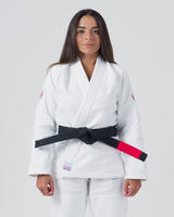 Kingz Empowered Women's Jiu Jitsu Gi White - Front View Female Athlete Pink Crown Shoulder Patches Black Belt KNGZ Tag Lapel Clean Design Durable Fabric BJJ Gi Training [color:White]