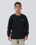 Kingz Type Youth Crew Black - Front View Youth Model Black Crewneck Long Sleeve White Kingz Chest Logo Casual Streetwear Apparel [color:Black]