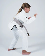 Kingz Nano 3.0 Youth BJJ Gi White - Upper Body Front View Girl Athlete Gray Belt NANO Text Crown Logo 380gsm Youth Kids Size