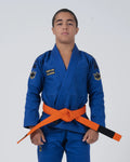 Kingz Comp V6 Youth BJJ Gi Blue - Upper Body Front View Teen Athlete Orange Belt HEAVY LIES THE CROWN Patch Crown Logo 450gsm