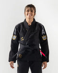 Kingz Comp 450 V6 Women's Gi Black - Front View Female Athlete Black Gi Yellow Crown Patches Embroidered Logos Contrast Stitching Durable Weave BJJ Gi Training Competition [color:Black]
