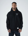 Kingz Leandro Lo Respect Hoodie - Front View - Chest Logo Worn by Male Model - Black - BJJ Lifestyle Hoodie