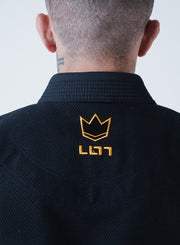 Kingz Legends Never Die Respect Gi Black - Back View Close-Up Crown Badge Embroidery Yellow Text Black Fabric Texture Premium Stitching BJJ Gi [color:Black]