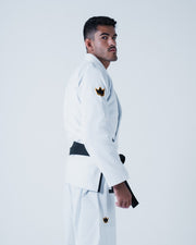 Kingz Legends Never Die Respect Gi - White - Side View Male Athlete Black Belt Crown Badge Sleeve and Pants Minimalist Design BJJ Gi Training Apparel [color:White]