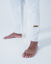 Kingz Legends Never Die Respect Gi - White - Close-Up Lower Leg View KINGZ Text Embroidered Ankle White Fabric Durable Stitching BJJ Gi [color:White]