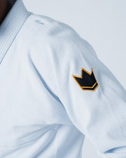 Kingz Legends Never Die Respect Gi - White - Close-Up Sleeve View Embroidered Black Gold Crown Badge Textured Fabric BJJ Gi [color:White]