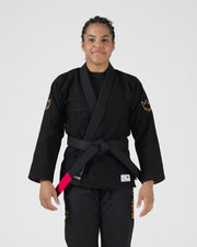Kingz Legends Never Die Respect Women's Gi Black - Front View Female Athlete Black Gi Gold Crown Sleeve Patch Pink Belt Tip Embroidered Text Durable Fabric BJJ Gi Training [color:Black]