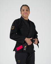 Kingz Legends Never Die Respect Women's Gi - Black - Front View Female Athlete Black Gi Gold Crown Shoulder Patch Red Rank Bar KINGZ Logo Lapel Durable Weave BJJ Gi [color:Black]
