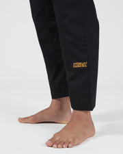 Kingz Legends Never Die Respect Women's Gi - Black - Close-Up Detail View Lower Leg Yellow KINGZ Embroidery Black Fabric Women's BJJ Gi Training Apparel [color:Black]