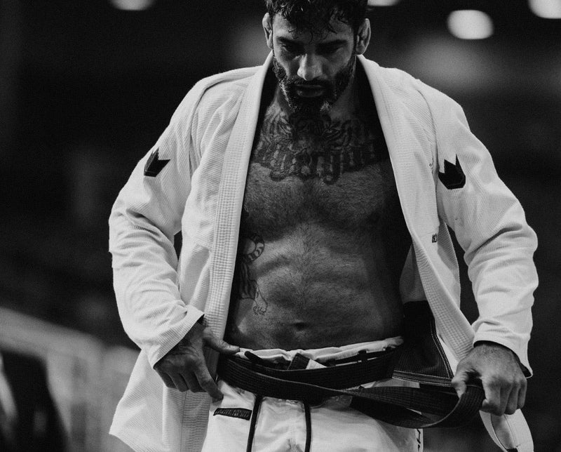 Leandro Lo tying his black belt