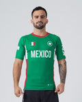 Kingz Jersey Rashguard Mexico Edition - Full Body Front View Male Athlete Short Sleeve Green Body MEXICO White Bold Text Mexican Flag Patch White Crown Logo Red Collar Red Side Stripes KINGZ Sleeve Text BJJ National Pride